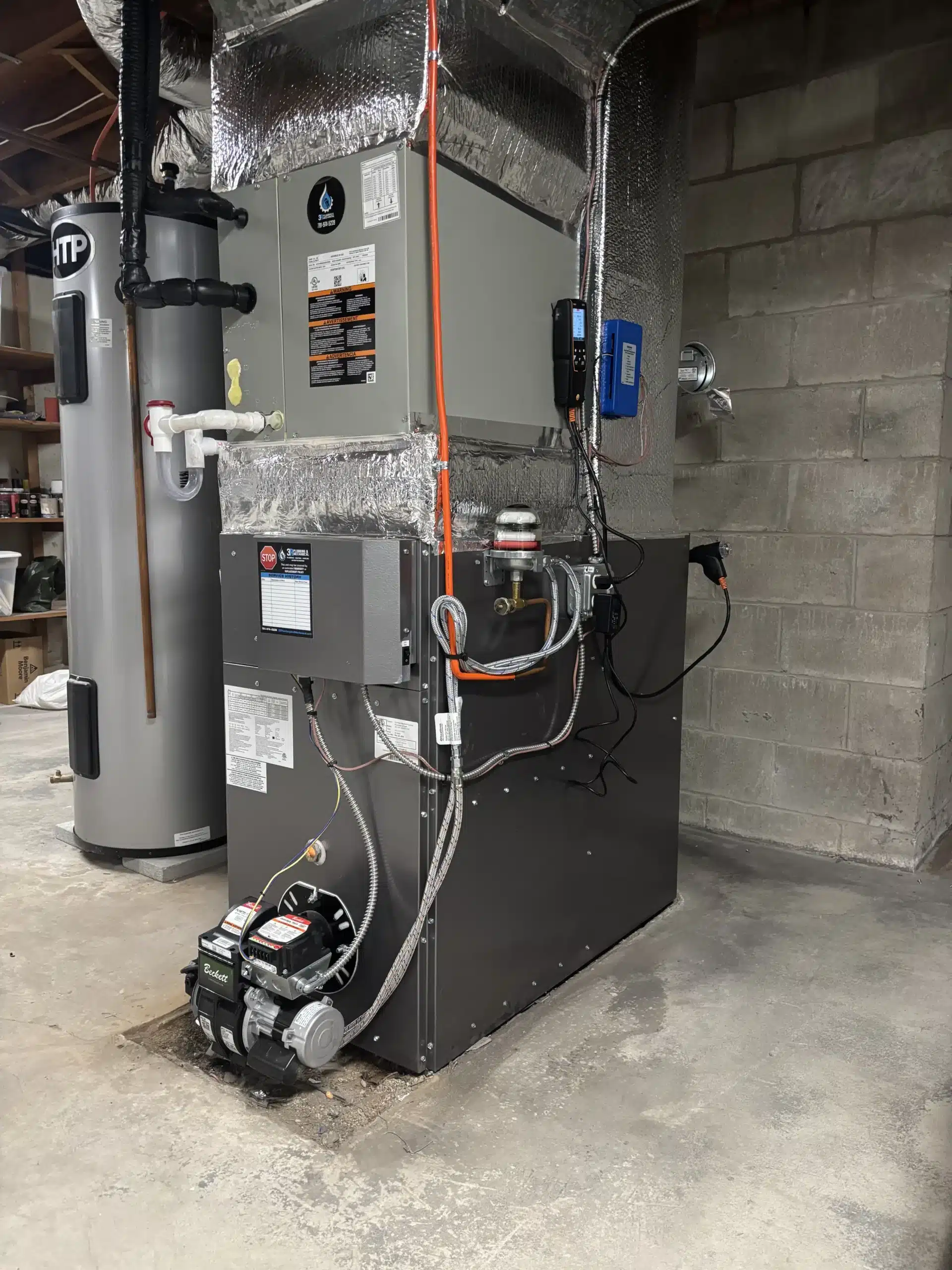 High-efficiency furnace installation in a Plymouth County, MA basement by 3R Plumbing & Mechanical, South Shore